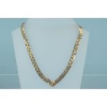 A 9ct gold weave link necklace with V shape terminal,