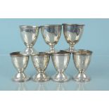 Seven various silver egg cups, all of plain form (some pairs),