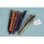 A Watermans ink pen, 'The De La Rue' pen, a Sheaffer,