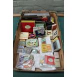 A selection of vintage cigarette tins and packets plus matchboxes etc