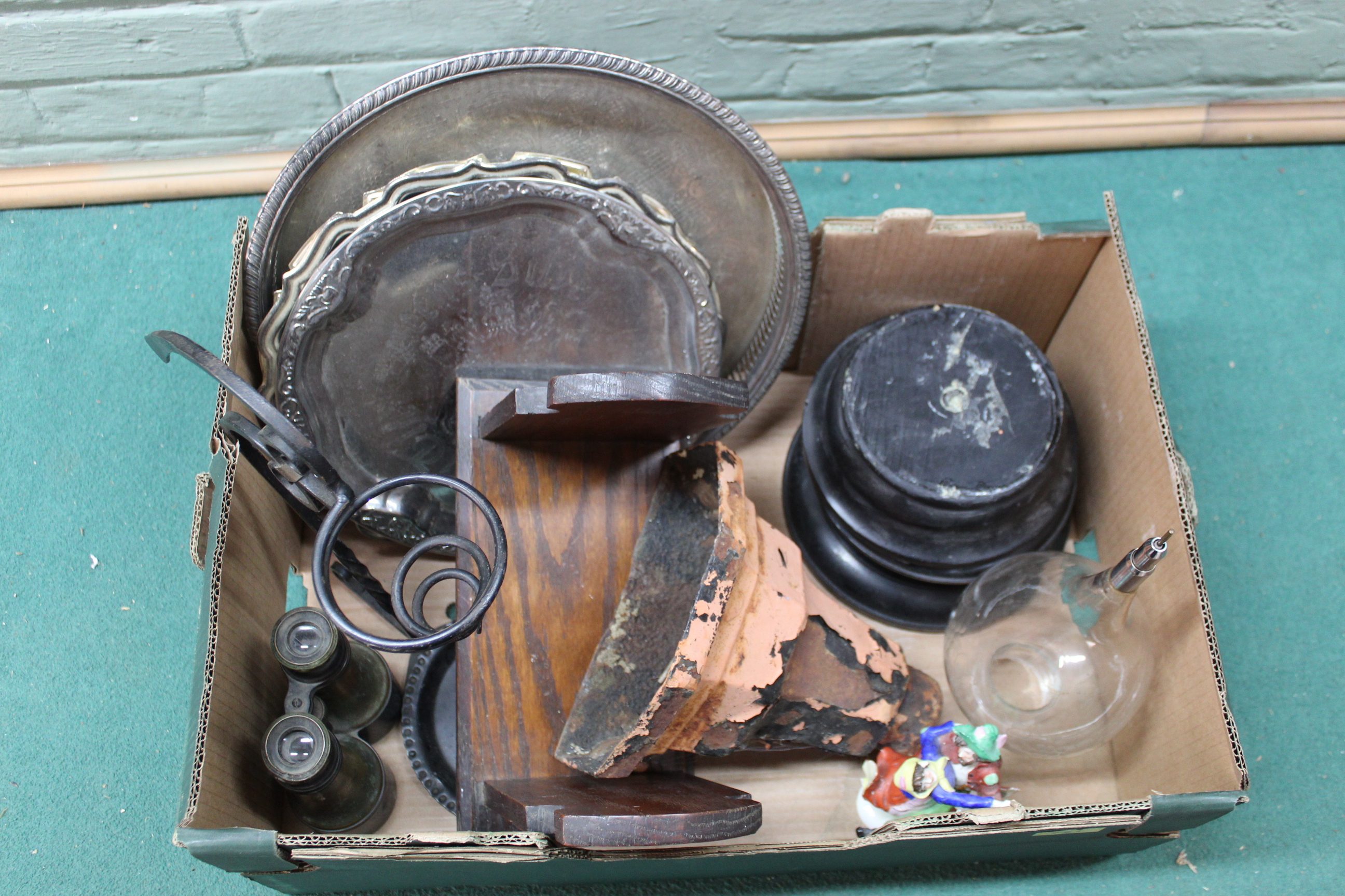 A mixed box of items including plated trays,