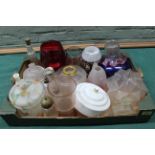 A selection of glass lamp shades, vases,