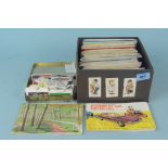 A small box of albums of tea cards,