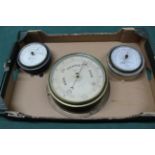 Three brass ships barometers: fisherman's aneroid barometer issued by the RNLI by Negretti & Zambra