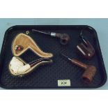 A cased Meerschaum pipe and three briar pipes