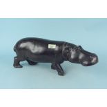 A carved hardwood model of an African hippopotamus,