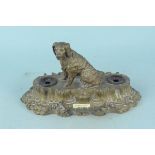 A spelter inkstand with hunting dog and shell decoration