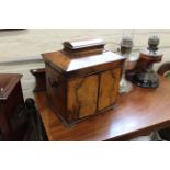 A 19th Century walnut workbox with two doors,