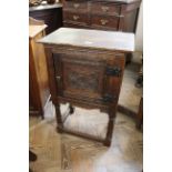A 19th Century Jacobean style small oak cupboard on stand