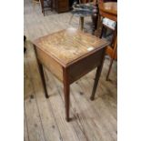 A 1920's oak work table with lift up top