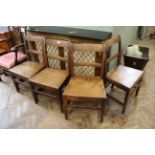 A set of four country oak dining chairs c.
