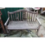 A weathered wooden garden bench