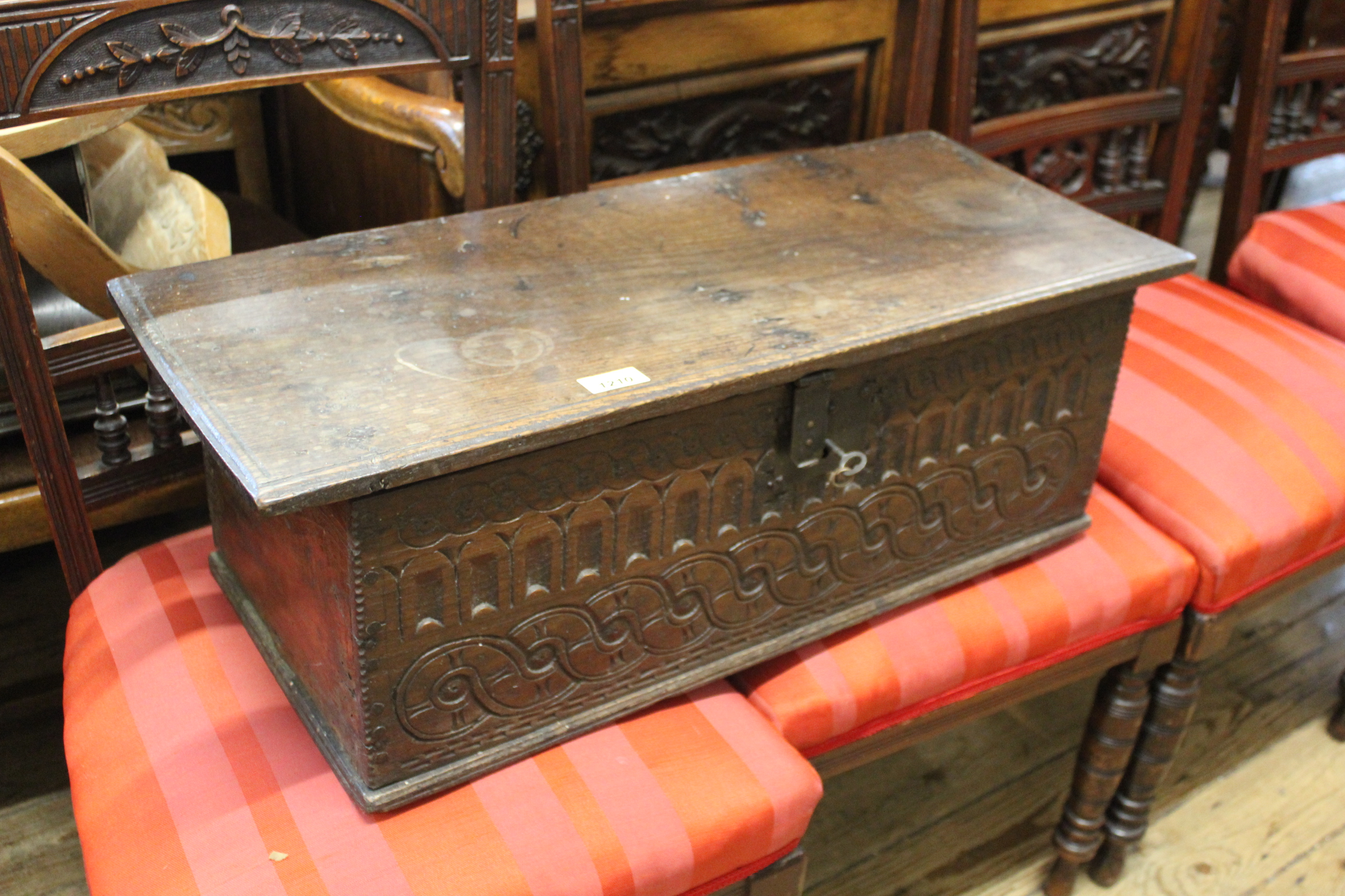 A late 17th Century carved oak deed box