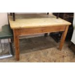 A late Victorian stripped pine single drawer kitchen table