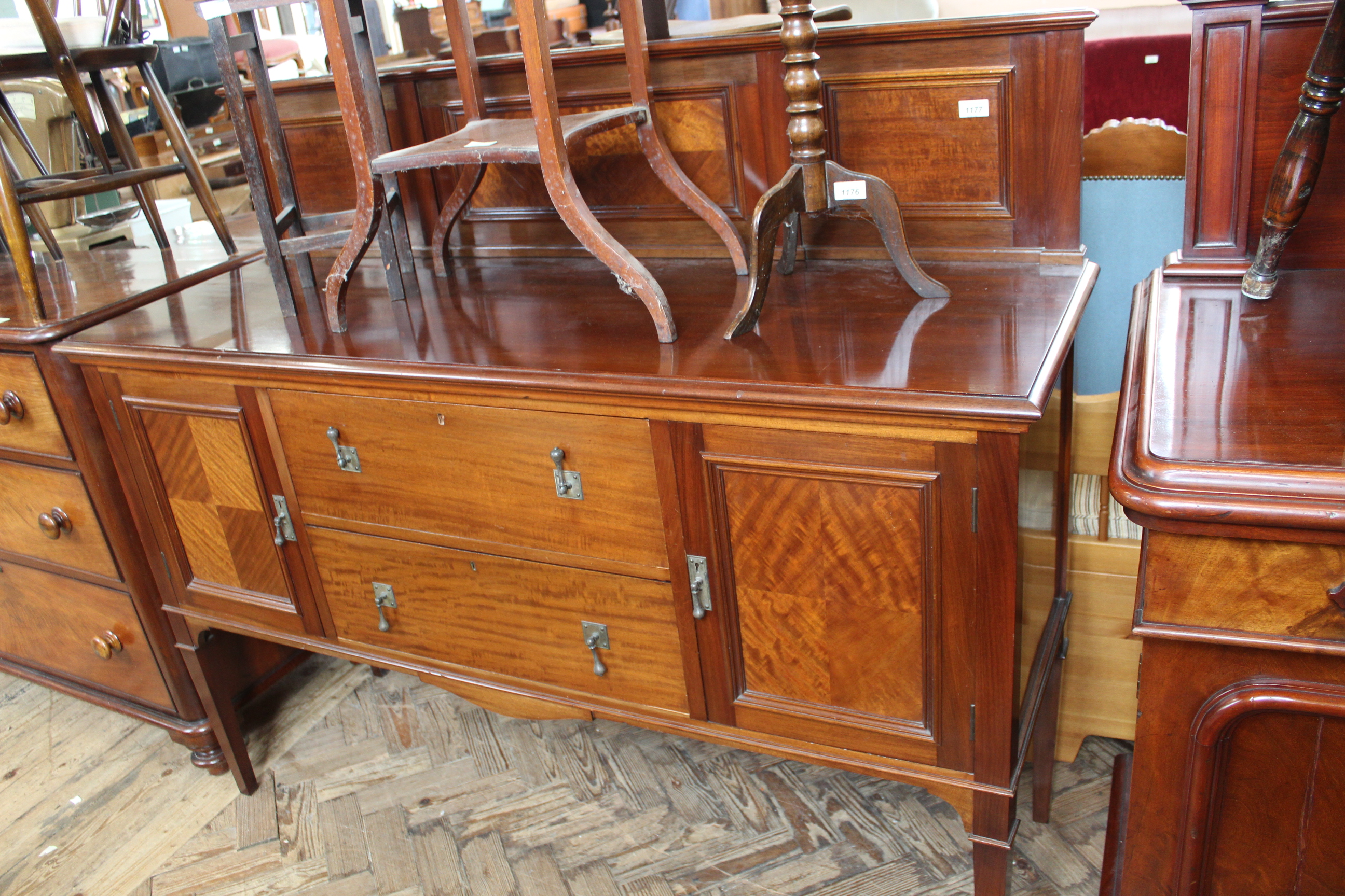 An Edwardian mahogany sideboard with panelled upstand