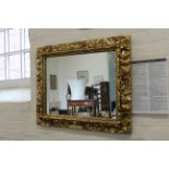 A late 19th Century gilt framed wall mirror