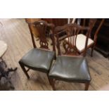 A pair of George III mahogany side chairs with leather seat