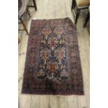 A small Oriental rug with deer motifs