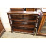 An Edwardian open bookcase in the Regency style, with fluted columns and bracket feet, Approx.