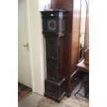 An Edwardian oak cased Grandmother clock