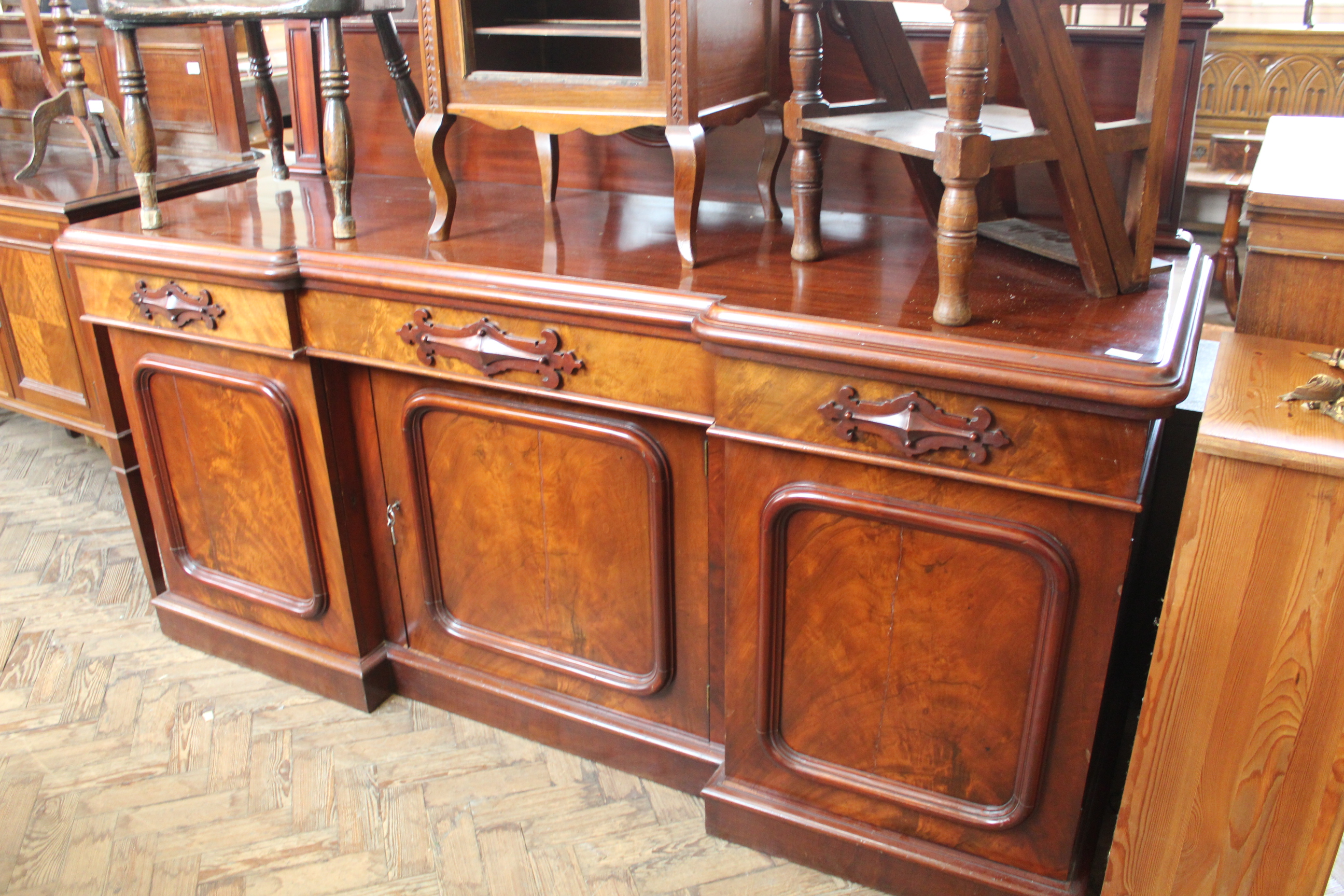 A mid Victorian mahogany sideboard, applied detail to drawer and three cupboards below, approx.