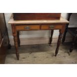 A late 19th Century pine two drawer side table