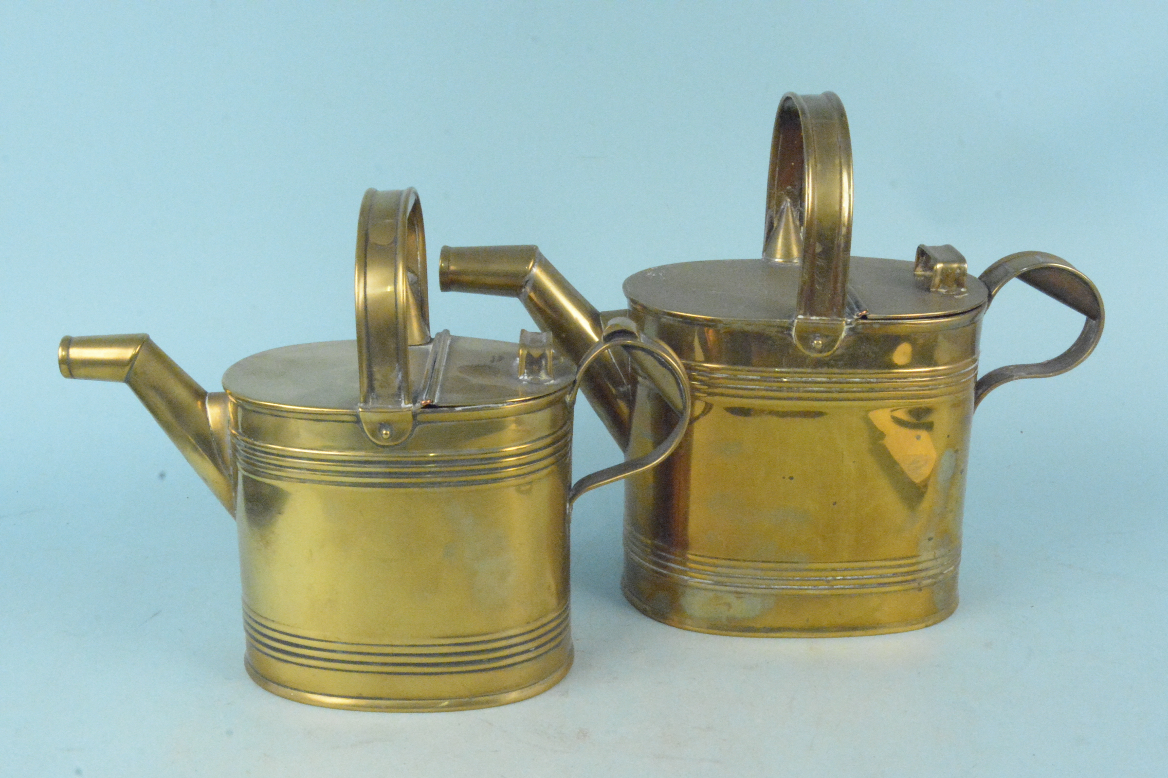 Two Edwardian brass watering cans