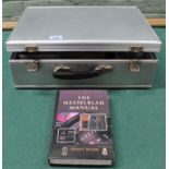 A vintage Hasselblad hard case together with 'The Hasselblad Manual' book