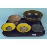 Three unmarked Studio pottery pieces including a footed bowl together with two hand painted bowls,