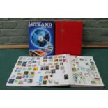 Three stamp albums and a folder,