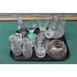 Assorted glassware including a 19th Century cut glass water jug, three spirit decanters,