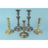 A pair of Queen Anne seamed brass candlesticks with knopped stems and octagonal bases, 17.