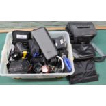 A box of assorted camera equipment and accessories