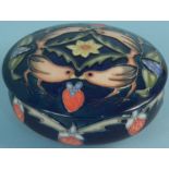 A boxed Moorcroft limited edition pot and lid in the Strawberry Thief pattern