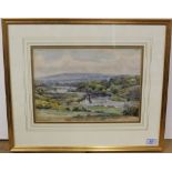A framed watercolour of sailing boats in a river landscape with hills in the background,