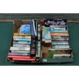 Two boxes of various military themed books including fiction and reference