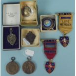 A hallmarked silver 1948 sports fob plus two medallions and various other fobs
