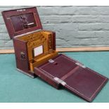 A vintage fold out travelling stationary box, wood interior with three small drawers,