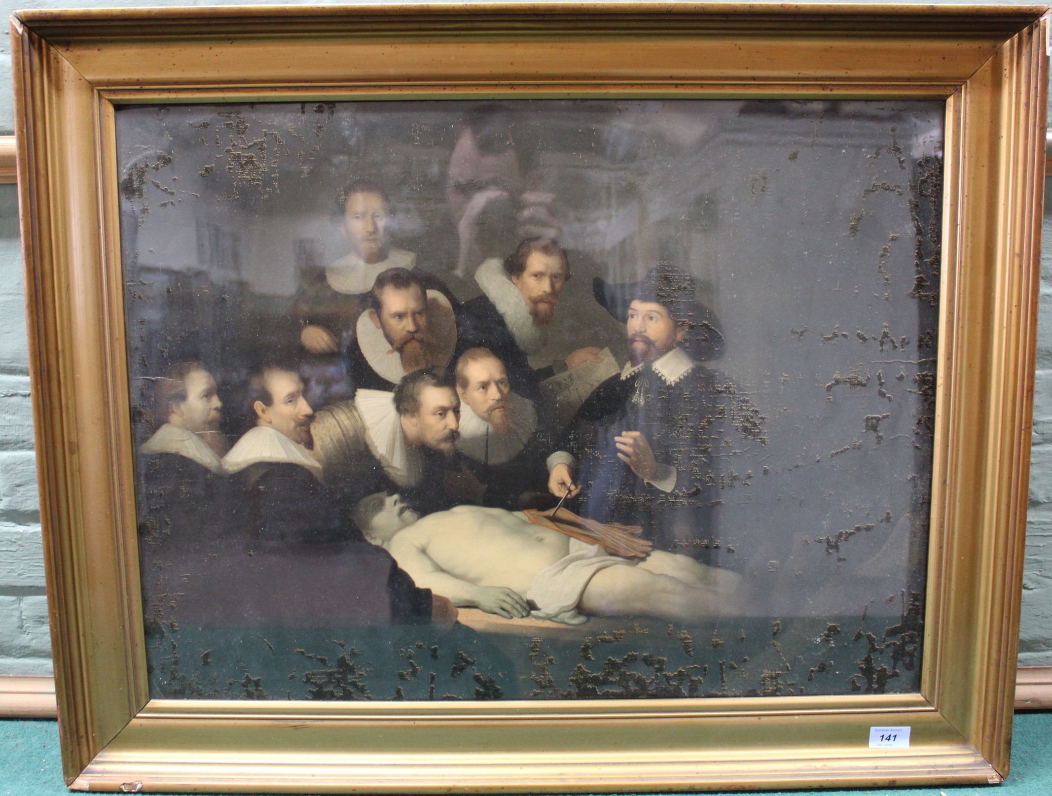 A framed print in swept gilt frame after 'A Lesson in Anatomy' by Rembrandt, 54.5cm x 72.