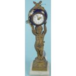 A 19th Century French gilded metal cherub supporting a ceramic clock,