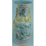 A large Oriental porcelain vase decorated with pheasants and other birds,