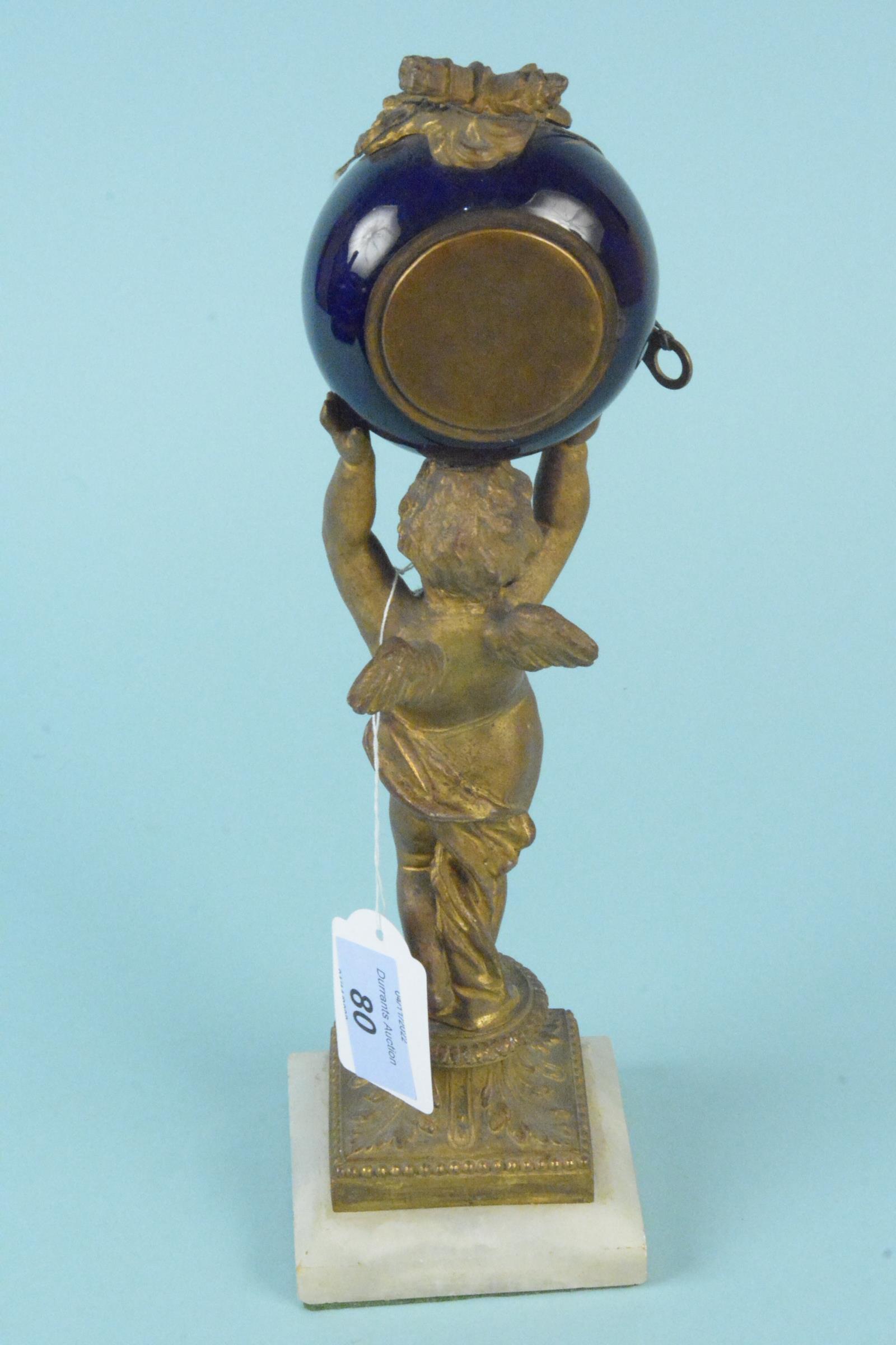 A 19th Century French gilded metal cherub supporting a ceramic clock, - Image 2 of 3