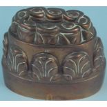 A Victorian oval copper jelly mould with raised decoration to sides and top, stamped '127', 6.