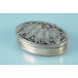 An antique white metal oval table snuff box with tortoiseshell panel to bottom and pierced