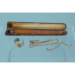 An amber cheroot holder with 9ct gold mount (as found),