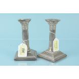 A pair of silver Corinthian column candlesticks, hallmarked Sheffield 1911, approx 14.
