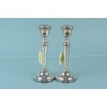 A pair of silver candlesticks, hallmarked Birmingham 1969, maker AT Cannon Ltd,