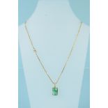 A 14ct gold jade pendant on yellow metal chain,