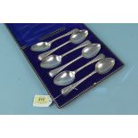 A cased set of six Victorian silver bead pattern spoons, each with engraved dog crest,