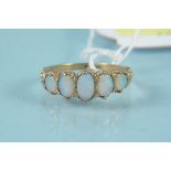 A 9ct gold five stone opal ring, size K,